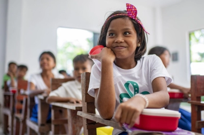 A girl with her meal in the class