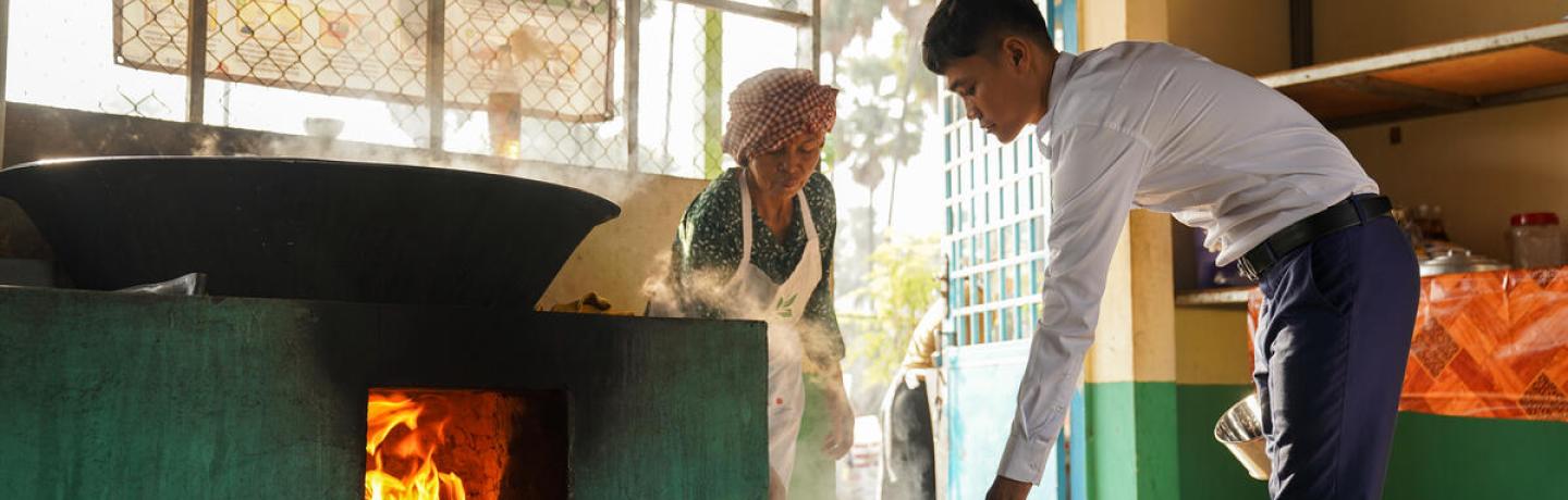 Om Sivorn is preparing the school meal for the students in the morning in Kampong Chhnang Province of Cambodia