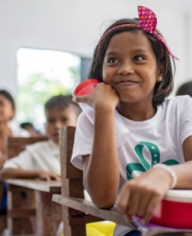 A girl with her meal at school. 